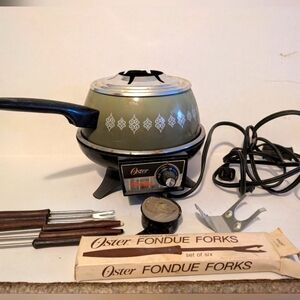 Vintage Oster Electric Fondue Set with forks.